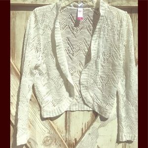 Sweater cover up , ivory colored yarn .